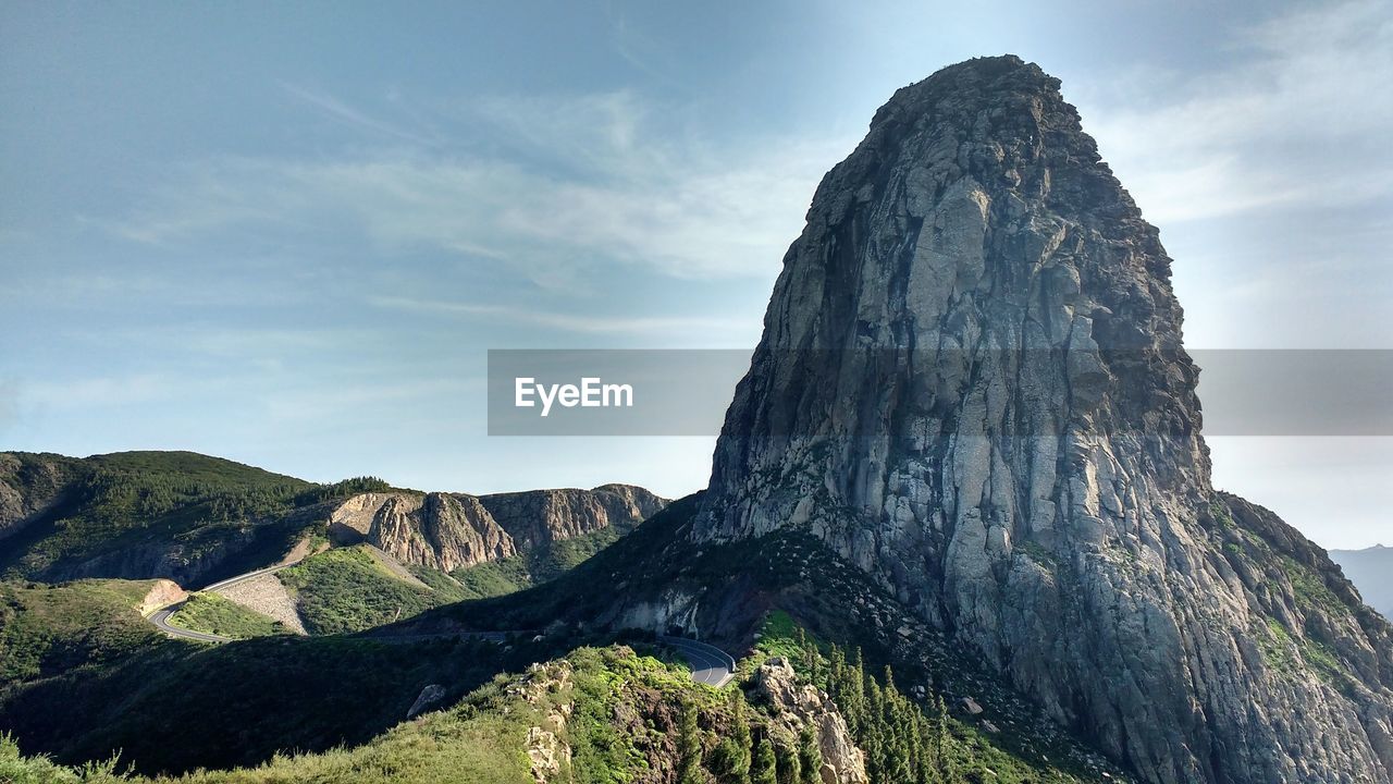View of mountain range against cloudy sky
