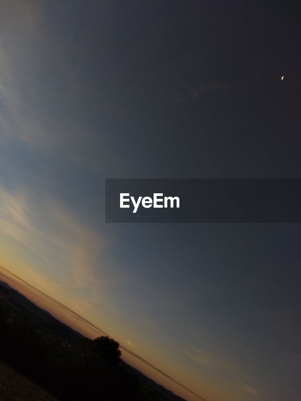 SCENIC VIEW OF SILHOUETTE LANDSCAPE AGAINST SKY DURING SUNSET