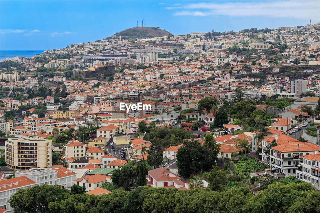 Aerial view of townscape against sky