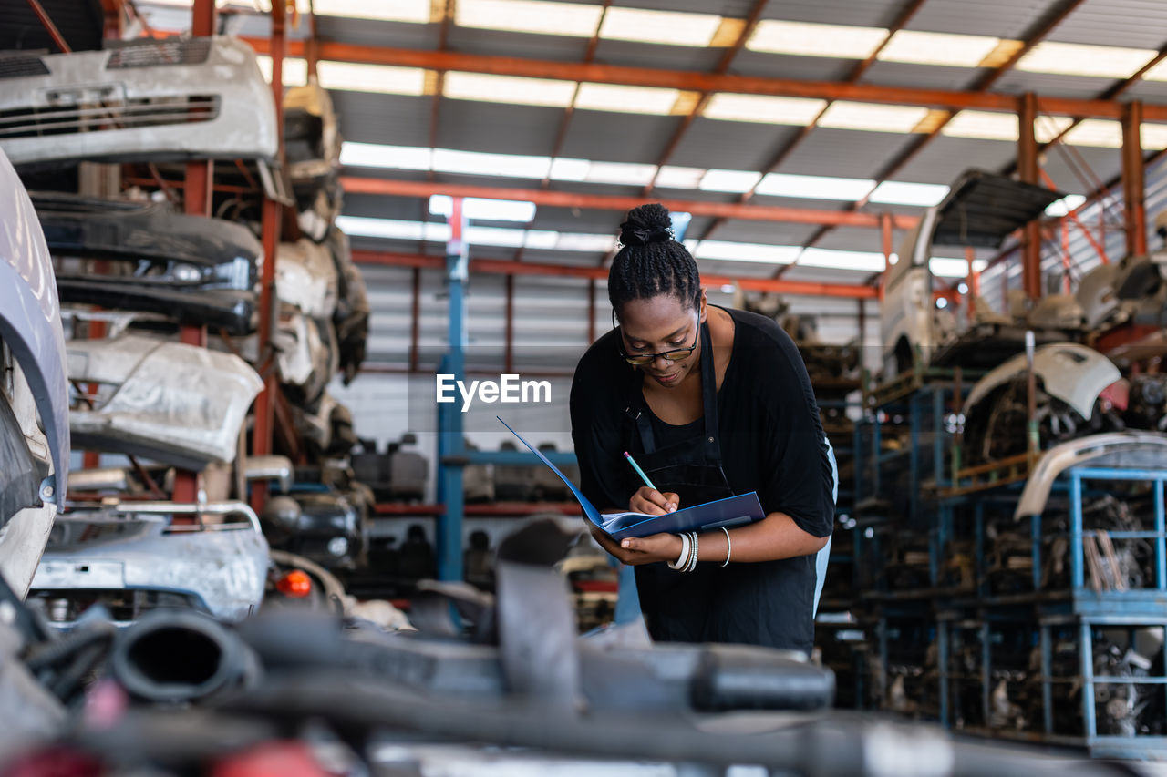 Female worker working in garage