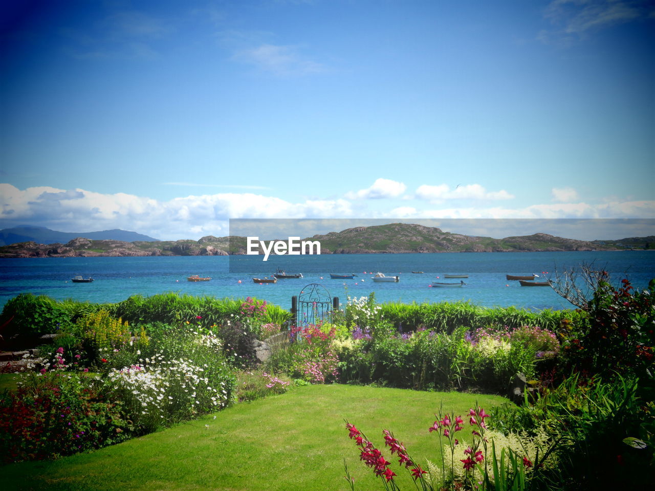 SCENIC VIEW OF LAKE AGAINST CLOUDY SKY