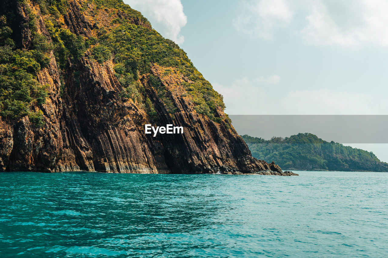 scenic view of sea against mountain