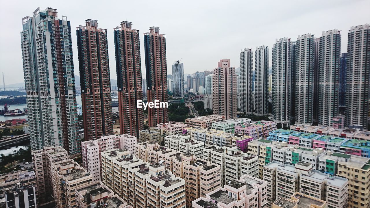 High angle view of modern buildings in city against sky