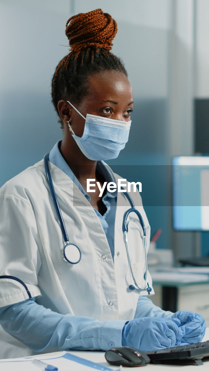 Doctor examining patient in laboratory