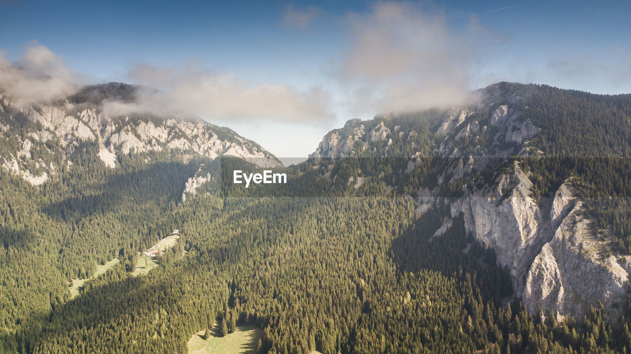 PANORAMIC VIEW OF LANDSCAPE AND MOUNTAINS