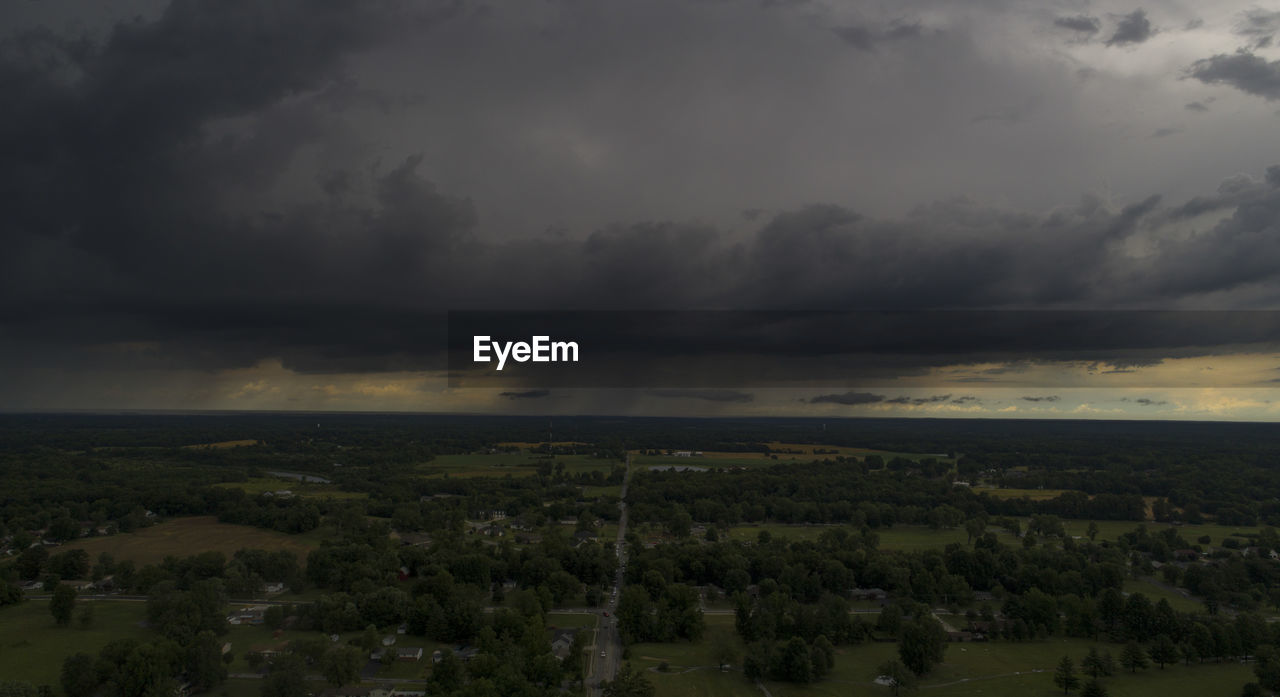 Scenic view of landscape against cloudy sky
