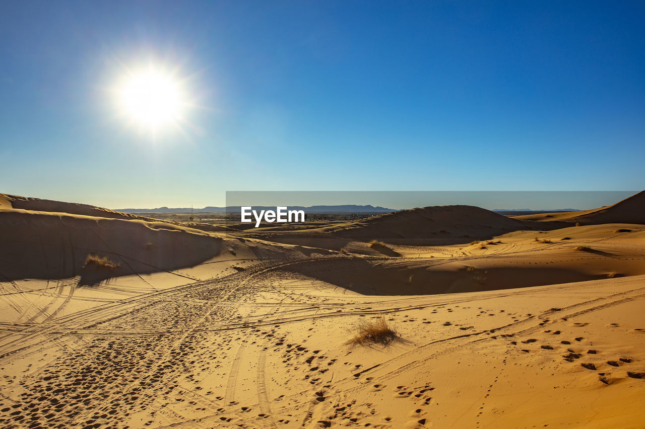 Scenic view of desert against clear sky