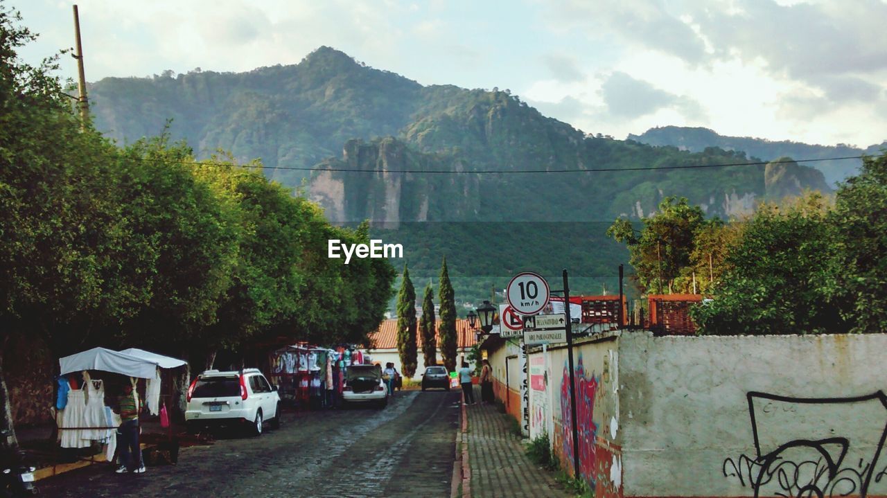 VIEW OF ROAD AGAINST MOUNTAIN