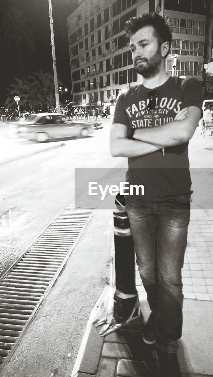 Young man standing in street