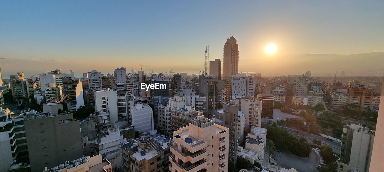 High angle view of cityscape against sky during sunset