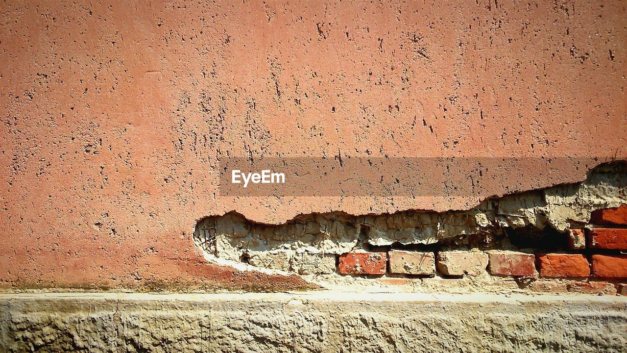 Damaged brick wall of house