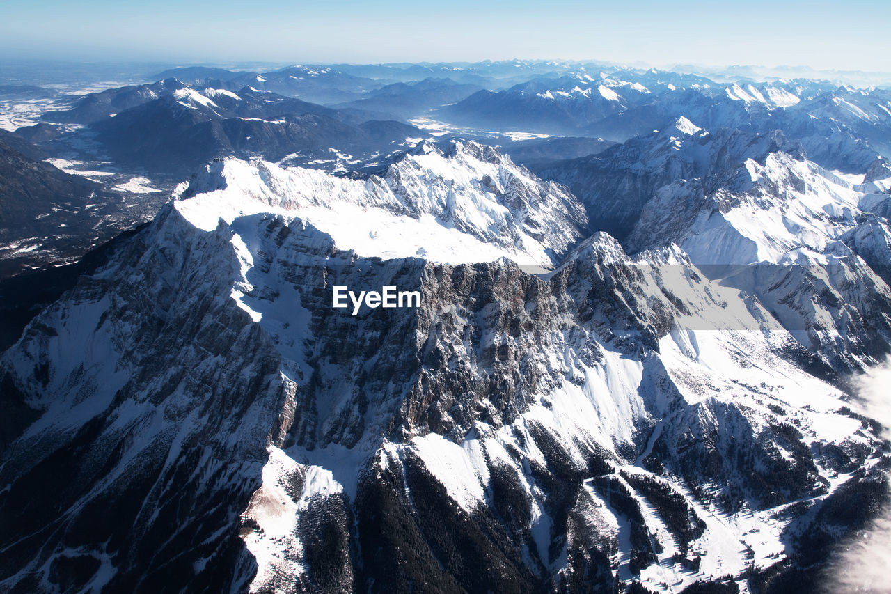 AERIAL VIEW OF SNOWCAPPED MOUNTAINS