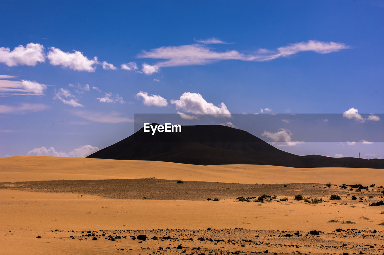 Scenic view of desert against sky