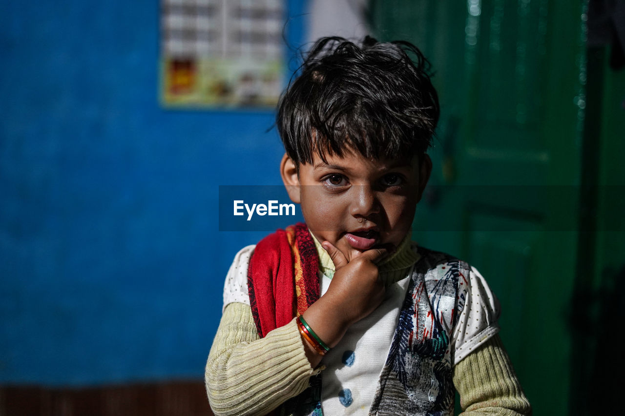 PORTRAIT OF BOY WEARING CAMERA