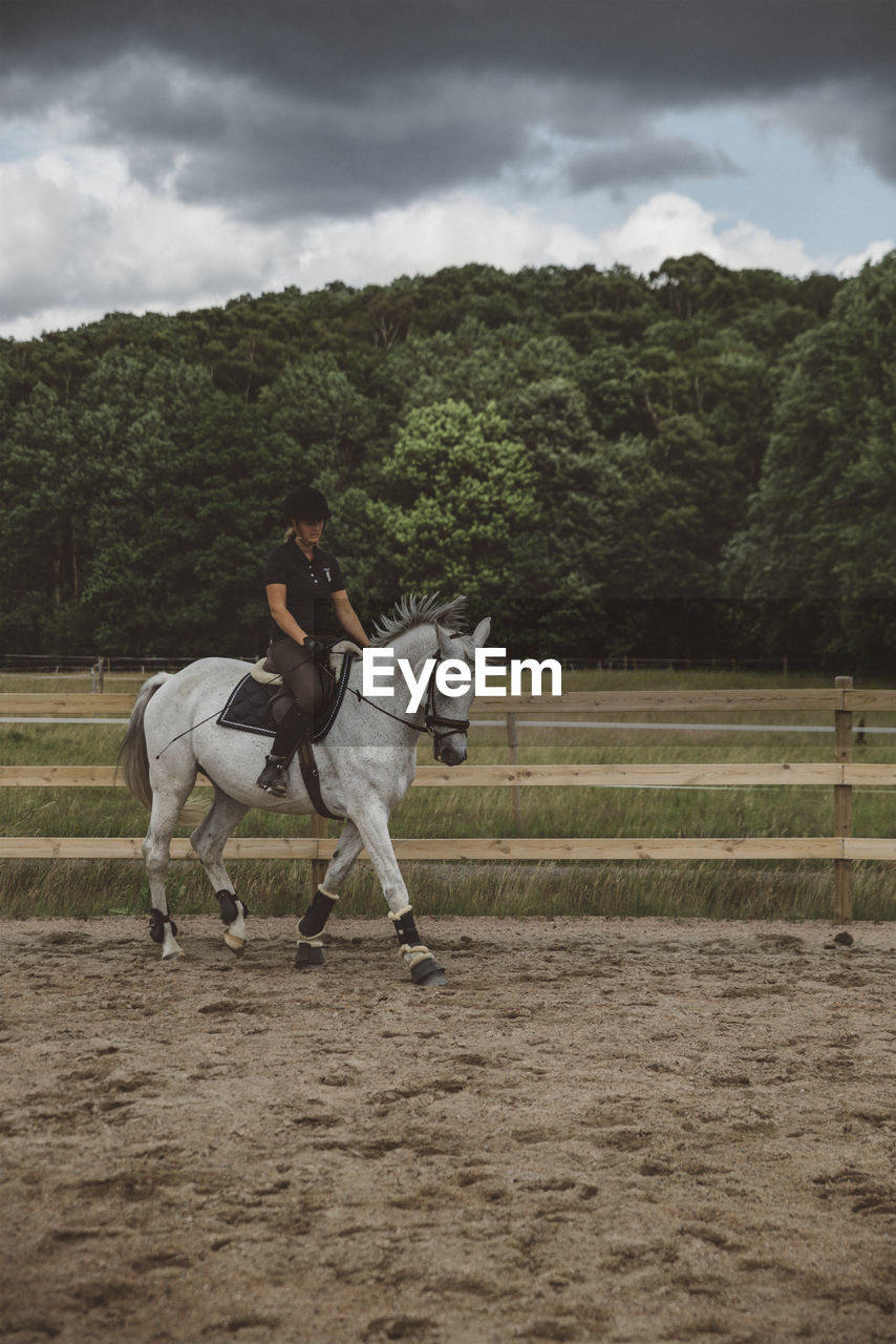 Woman riding horse