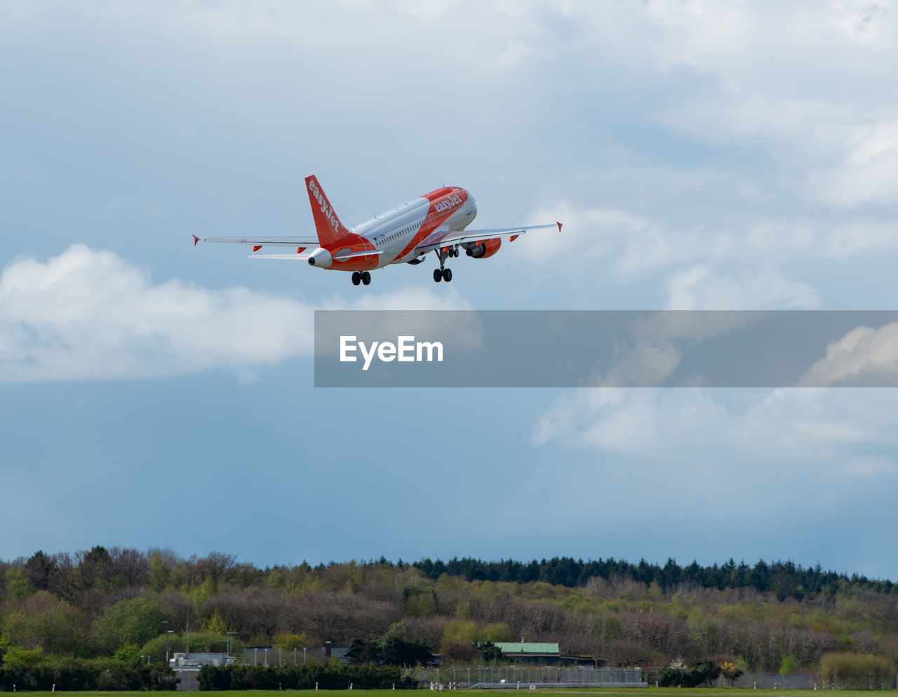 LOW ANGLE VIEW OF AIRPLANE IN SKY