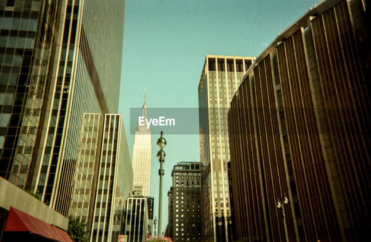 Low angle view of modern buildings against clear sky