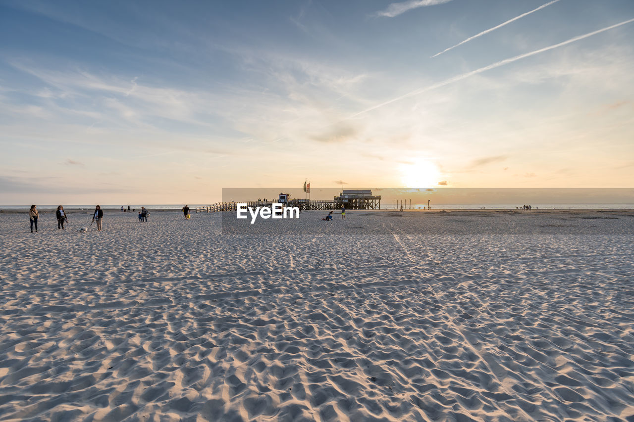 Scenic view of beach against sky during sunset