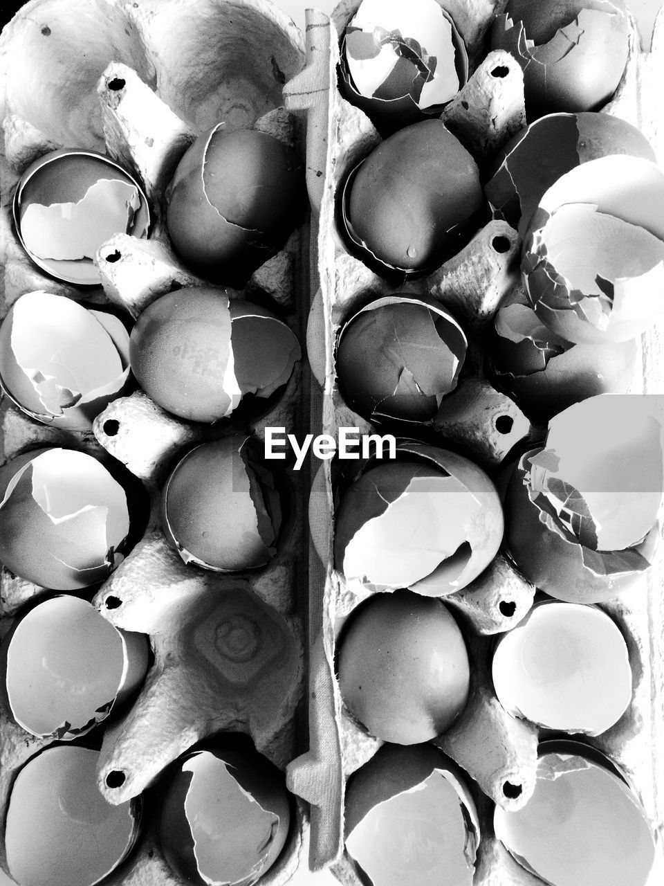 Full frame shot of eggshells in carton