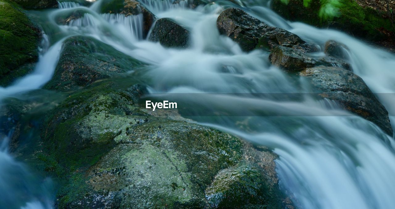 SCENIC VIEW OF WATERFALL