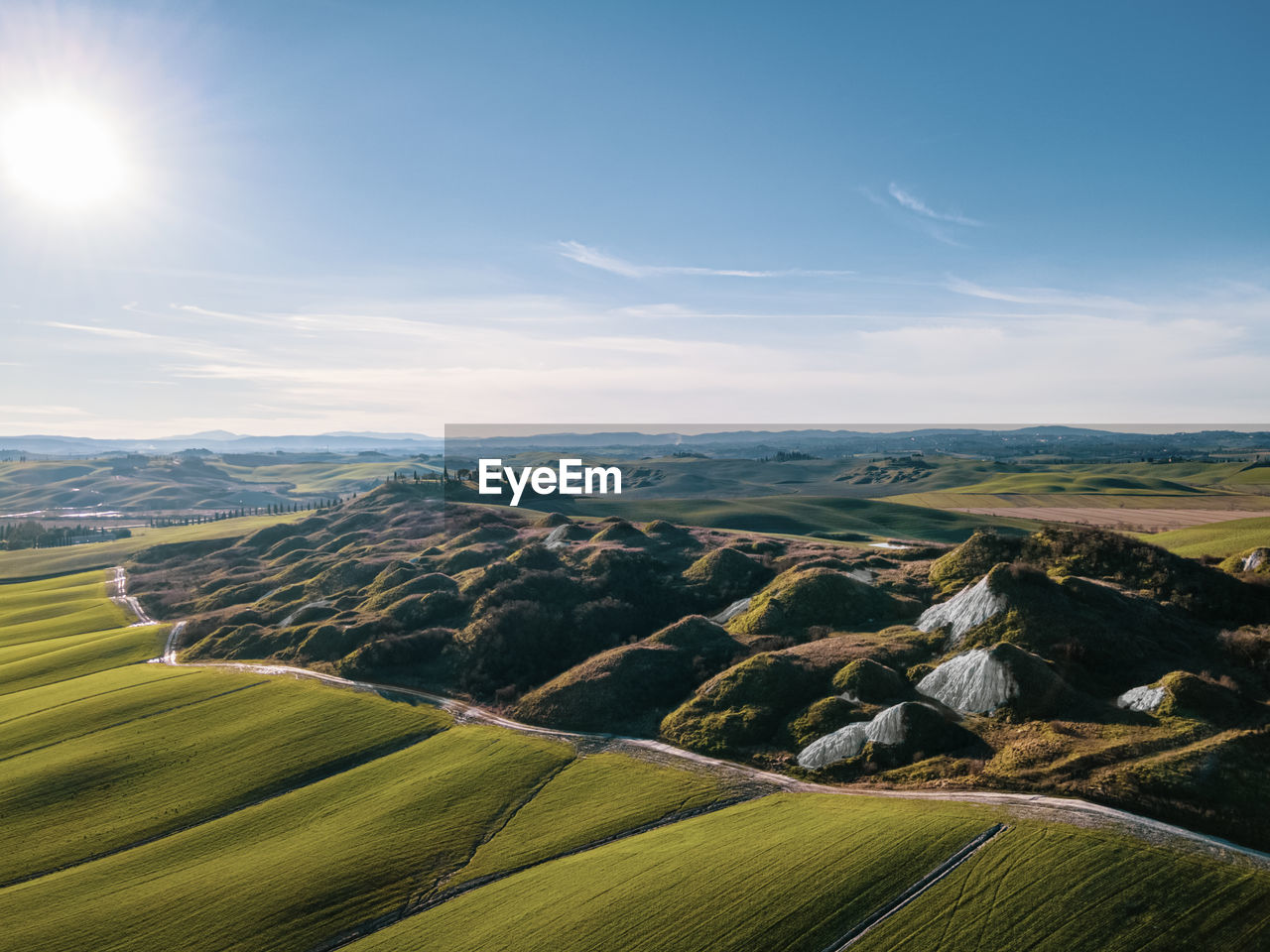 SCENIC VIEW OF LANDSCAPE AGAINST SKY DURING SUNRISE