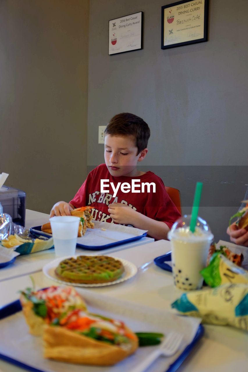 Boy having food at home