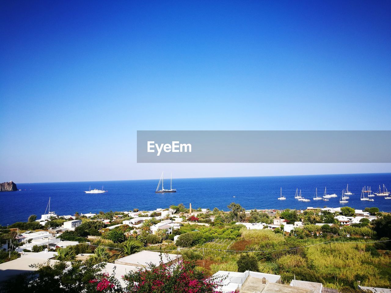 SAILBOATS ON SEA AGAINST CLEAR BLUE SKY
