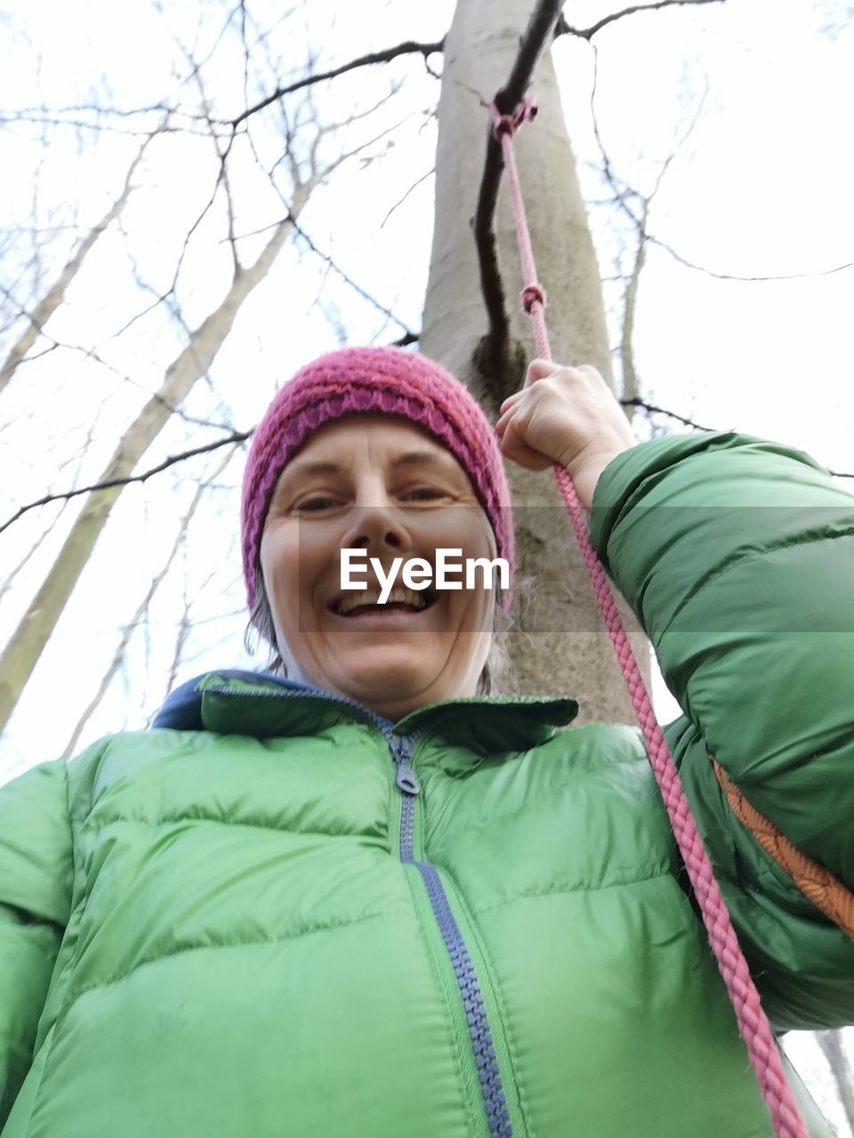 PORTRAIT OF SMILING WOMAN IN SNOW