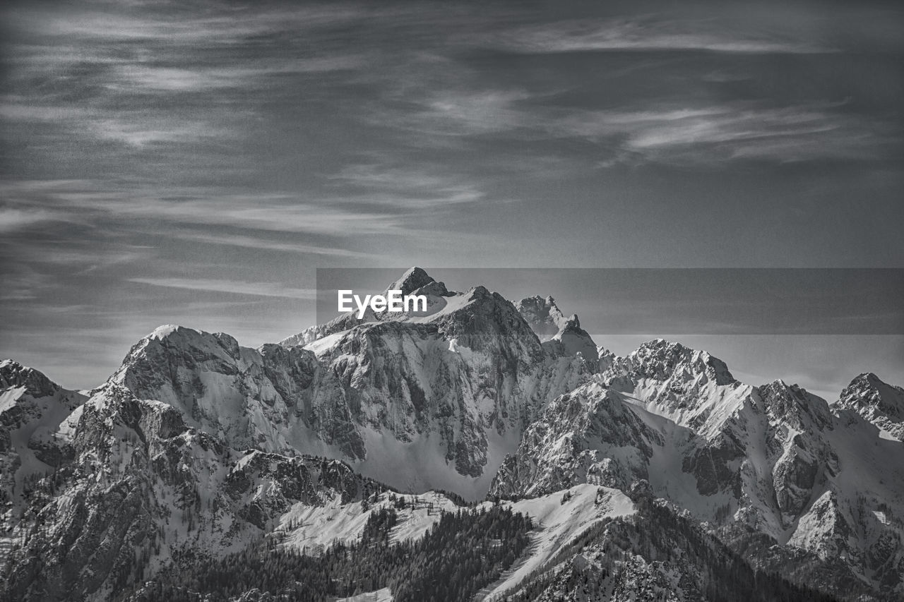 Scenic view of snowcapped mountains against sky