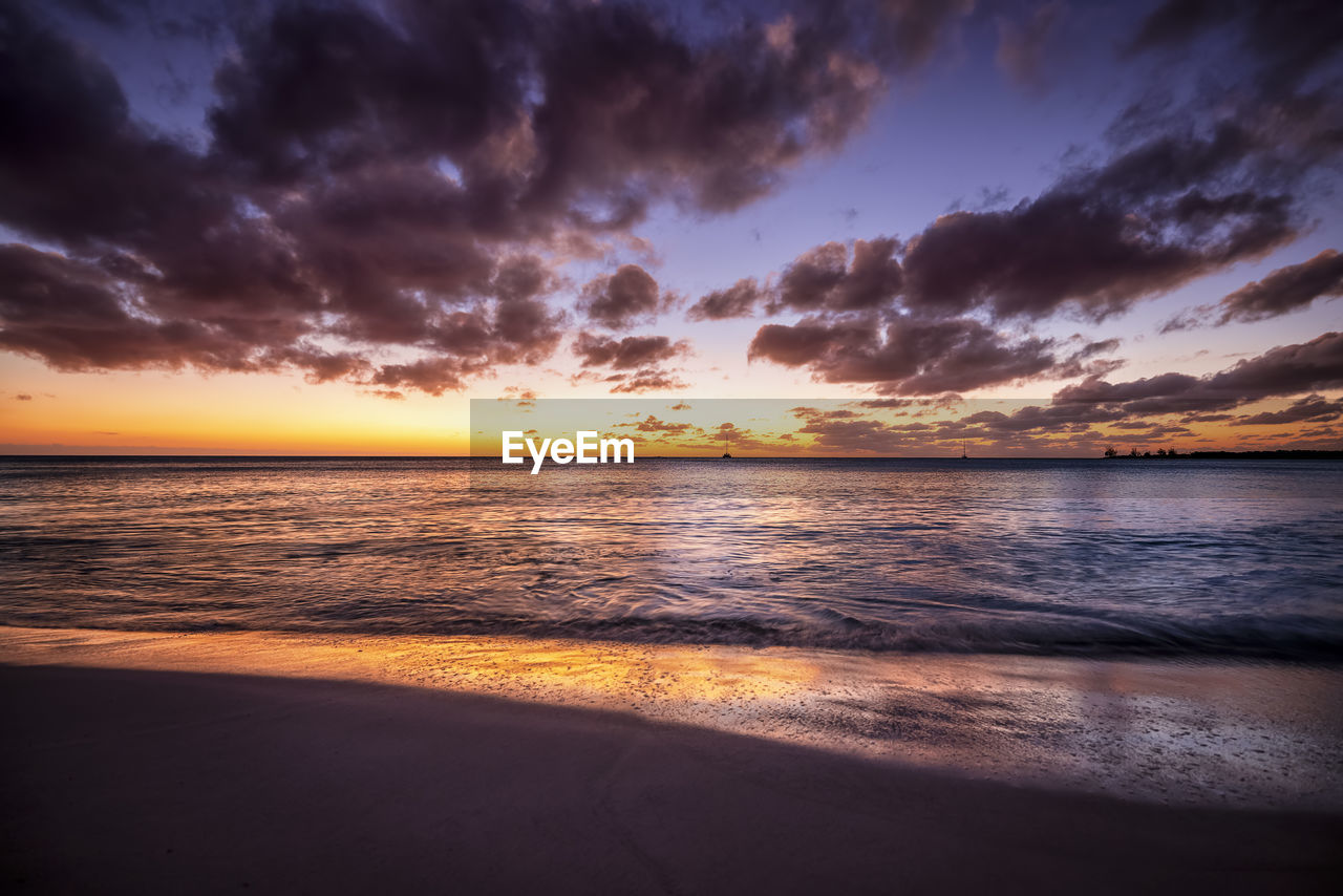 scenic view of sea against sky at sunset