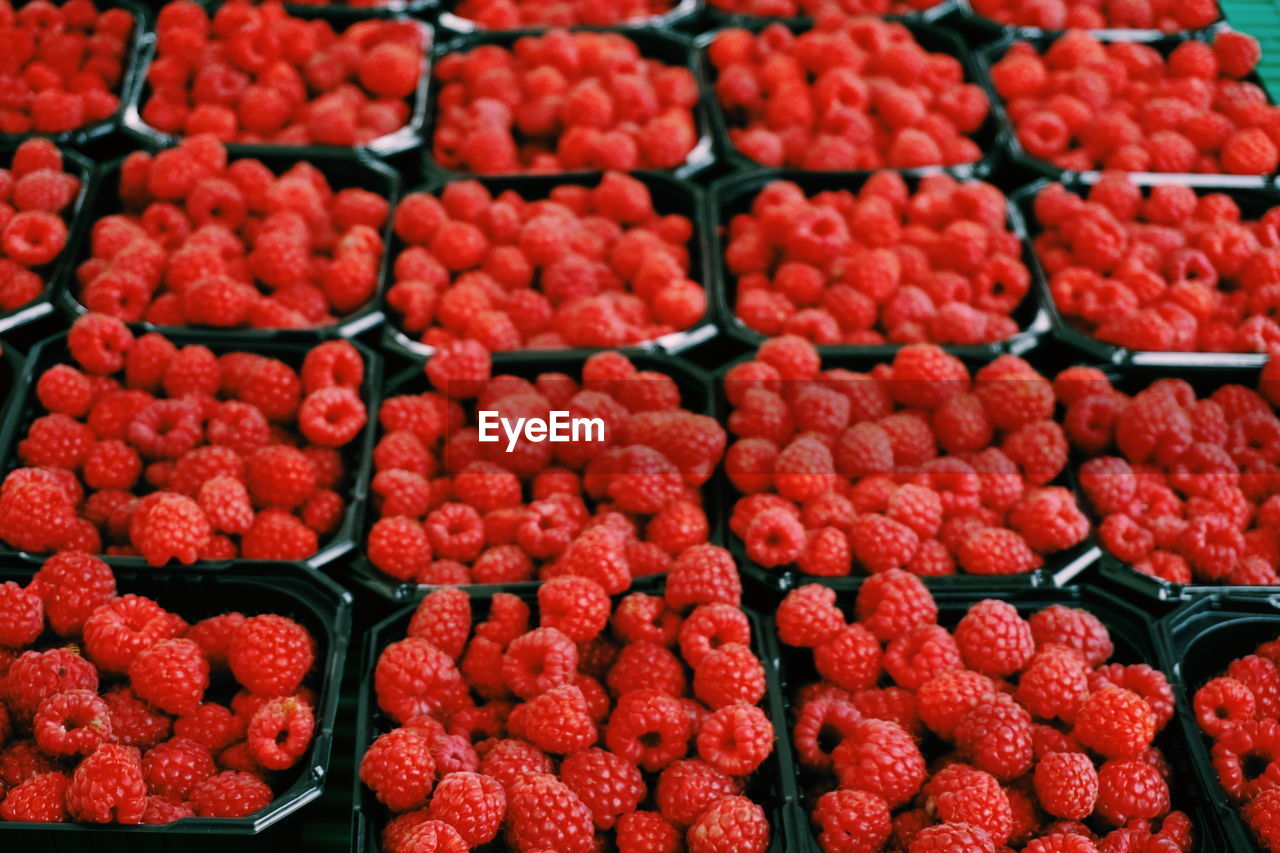 Full frame shot of raspberries for sale at market