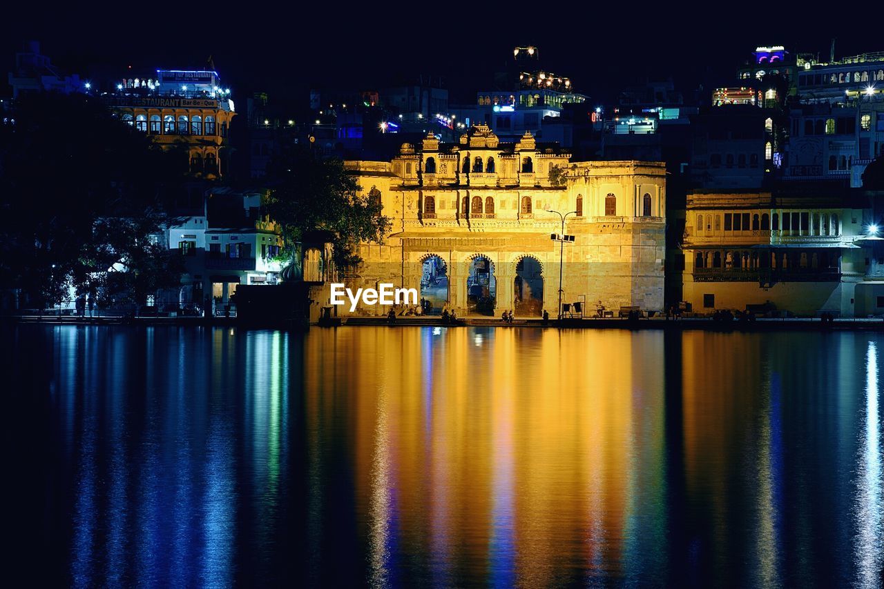 REFLECTION OF ILLUMINATED BUILDINGS IN RIVER