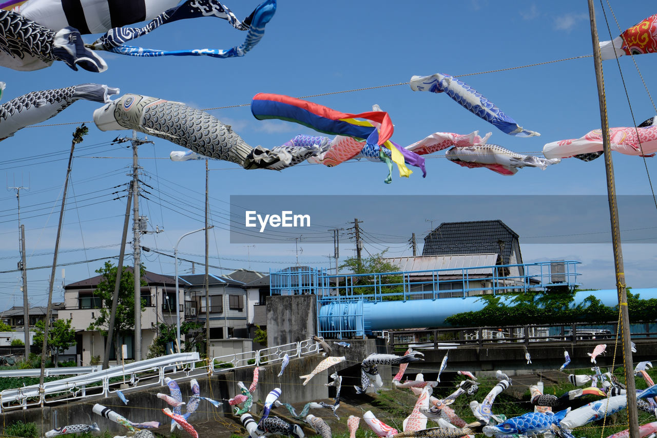 Koinobori hanging against sky