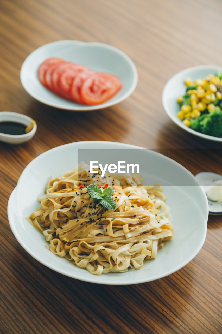 Healthy chinese breakfast noodles on a wooden table