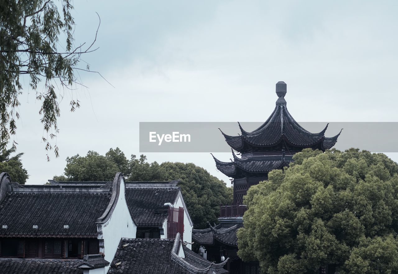 Panoramic view of temple and building against sky