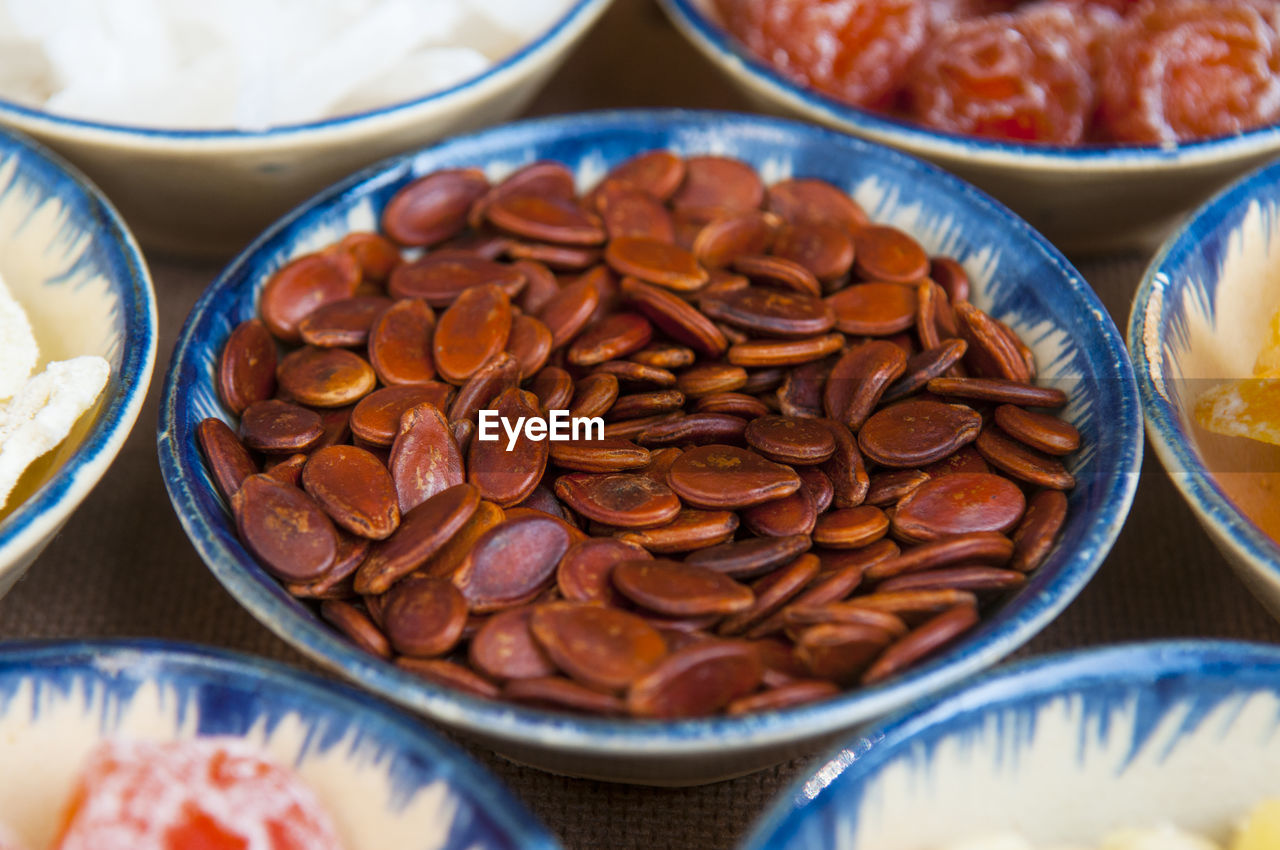 High angle view of seeds in bowl with food on table