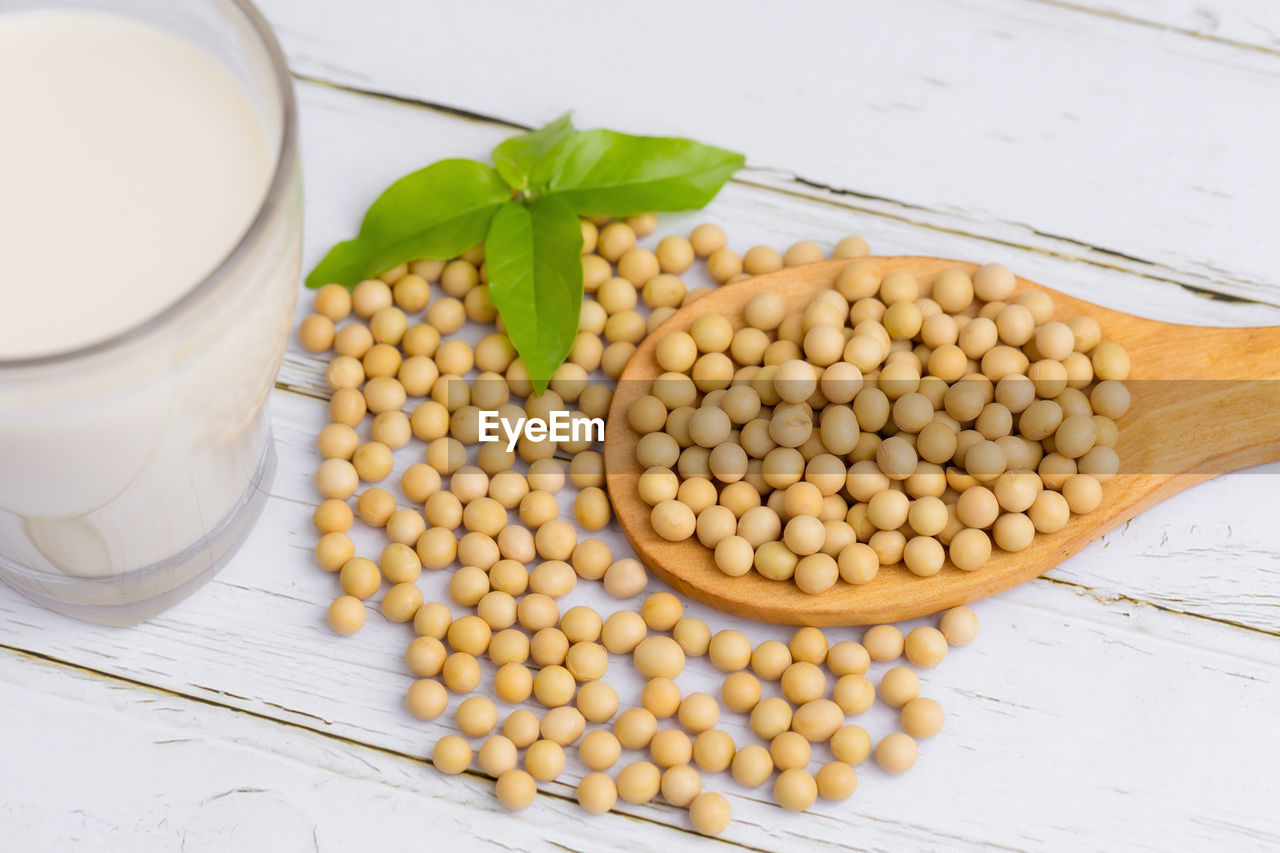 HIGH ANGLE VIEW OF EGGS IN CONTAINER ON TABLE