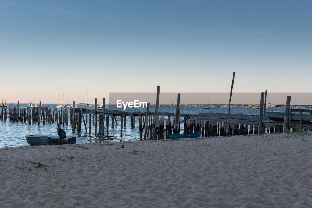 SCENIC VIEW OF BEACH AGAINST SKY DURING SUNSET