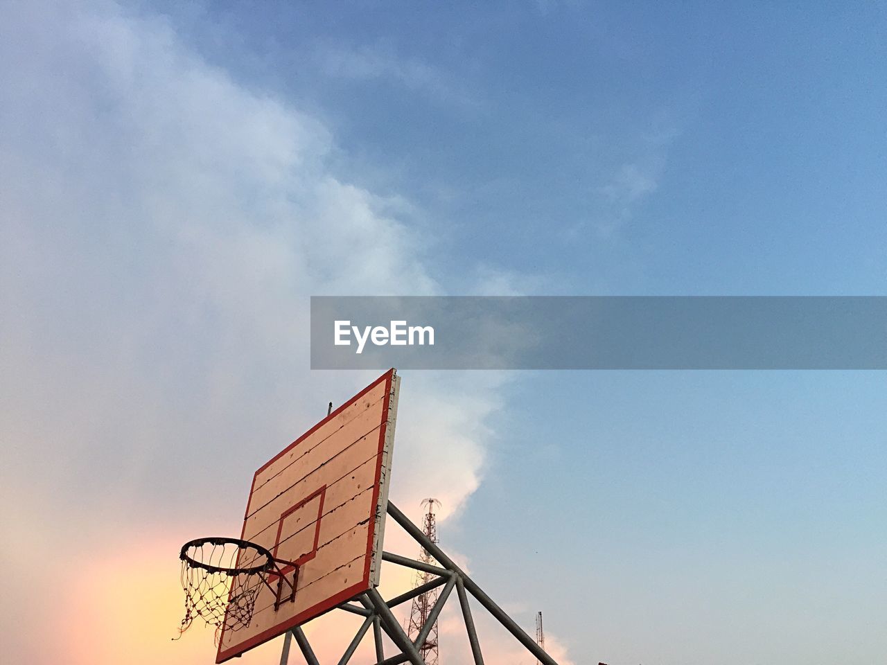 Low angle view of basketball hoop against sky,  play basketball evening 