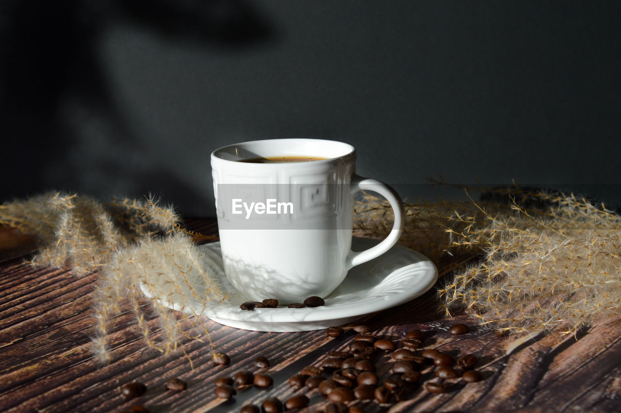 cup, mug, food and drink, drink, coffee, coffee cup, refreshment, hot drink, wood, indoors, crockery, table, saucer, studio shot, freshness, still life photography, no people, still life, food, tea, heat, close-up, tea cup