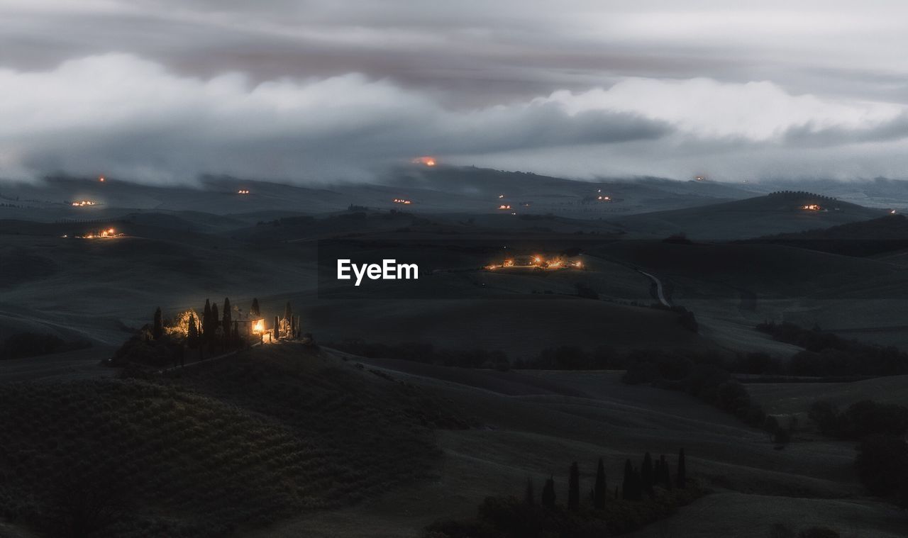 AERIAL VIEW OF ILLUMINATED LANDSCAPE AT NIGHT