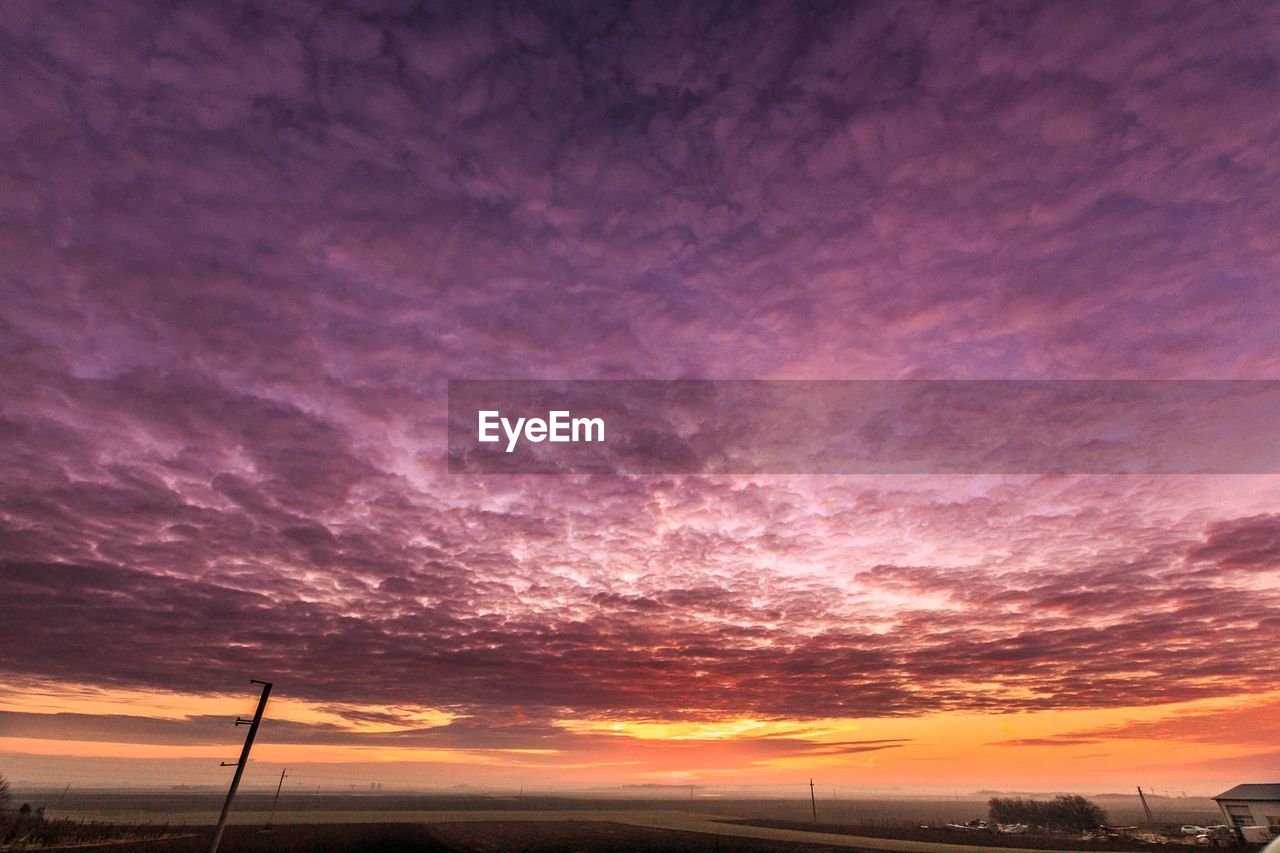 Scenic view of dramatic sky over landscape