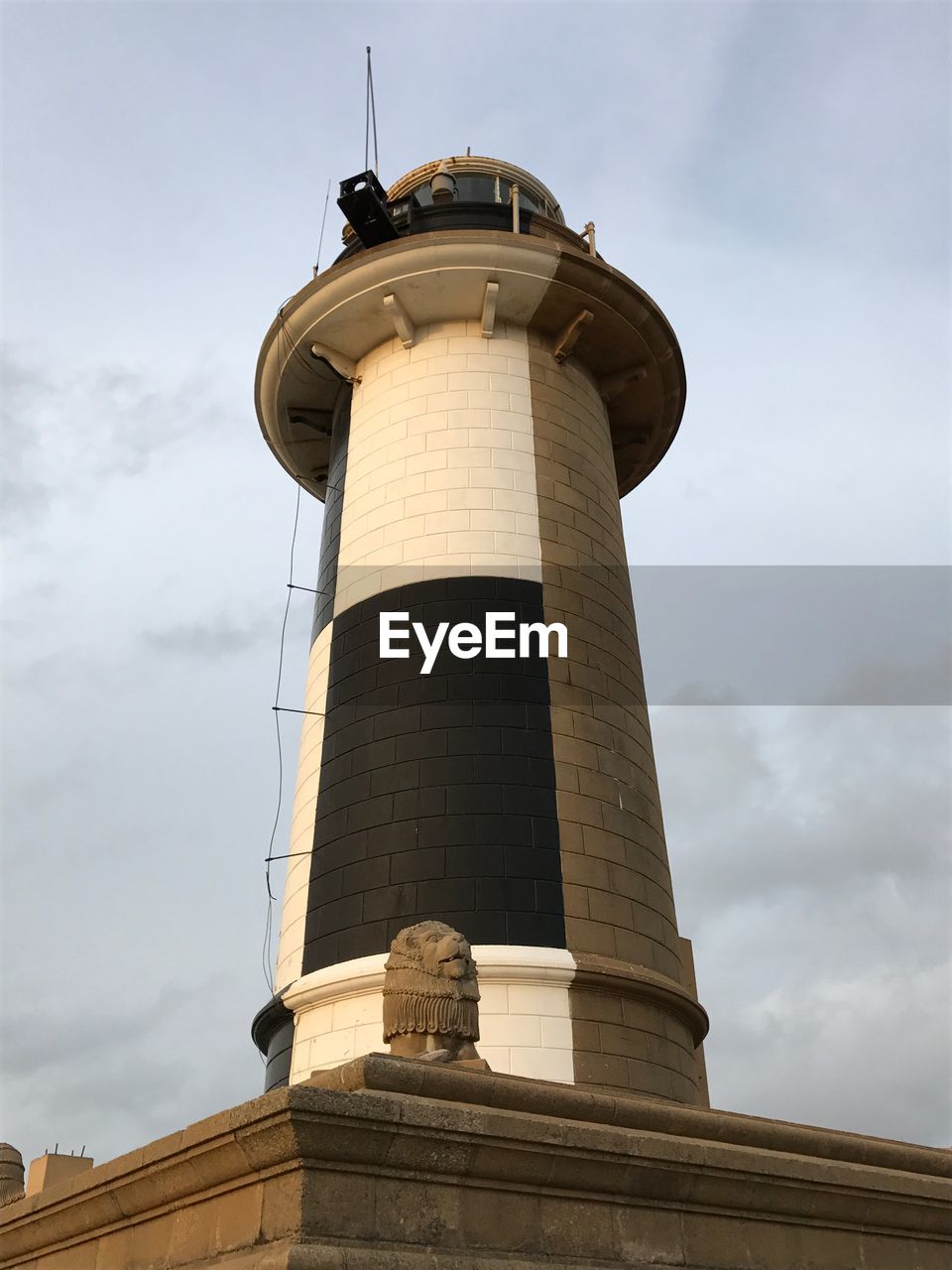 LOW ANGLE VIEW OF WATER TOWER ON LIGHTHOUSE AGAINST SKY