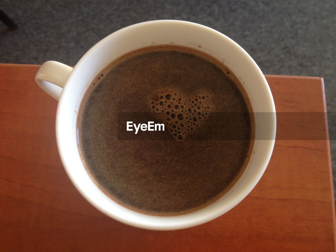 CLOSE-UP OF COFFEE CUP WITH COFFEE CUP