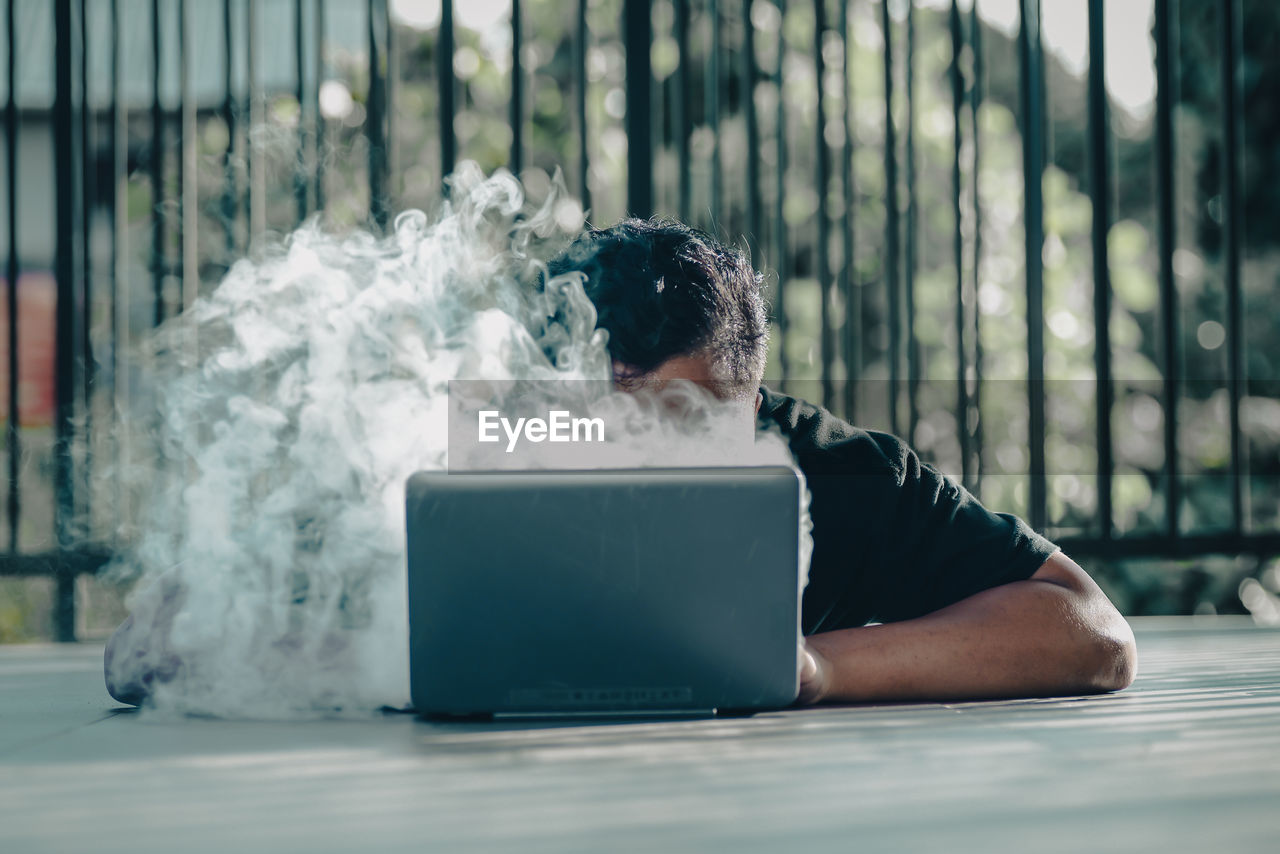 Woman using laptop at home