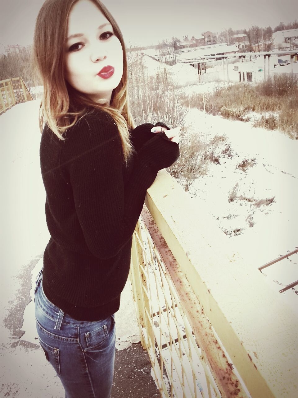 PORTRAIT OF WOMAN STANDING ON SNOW COVERED HAND