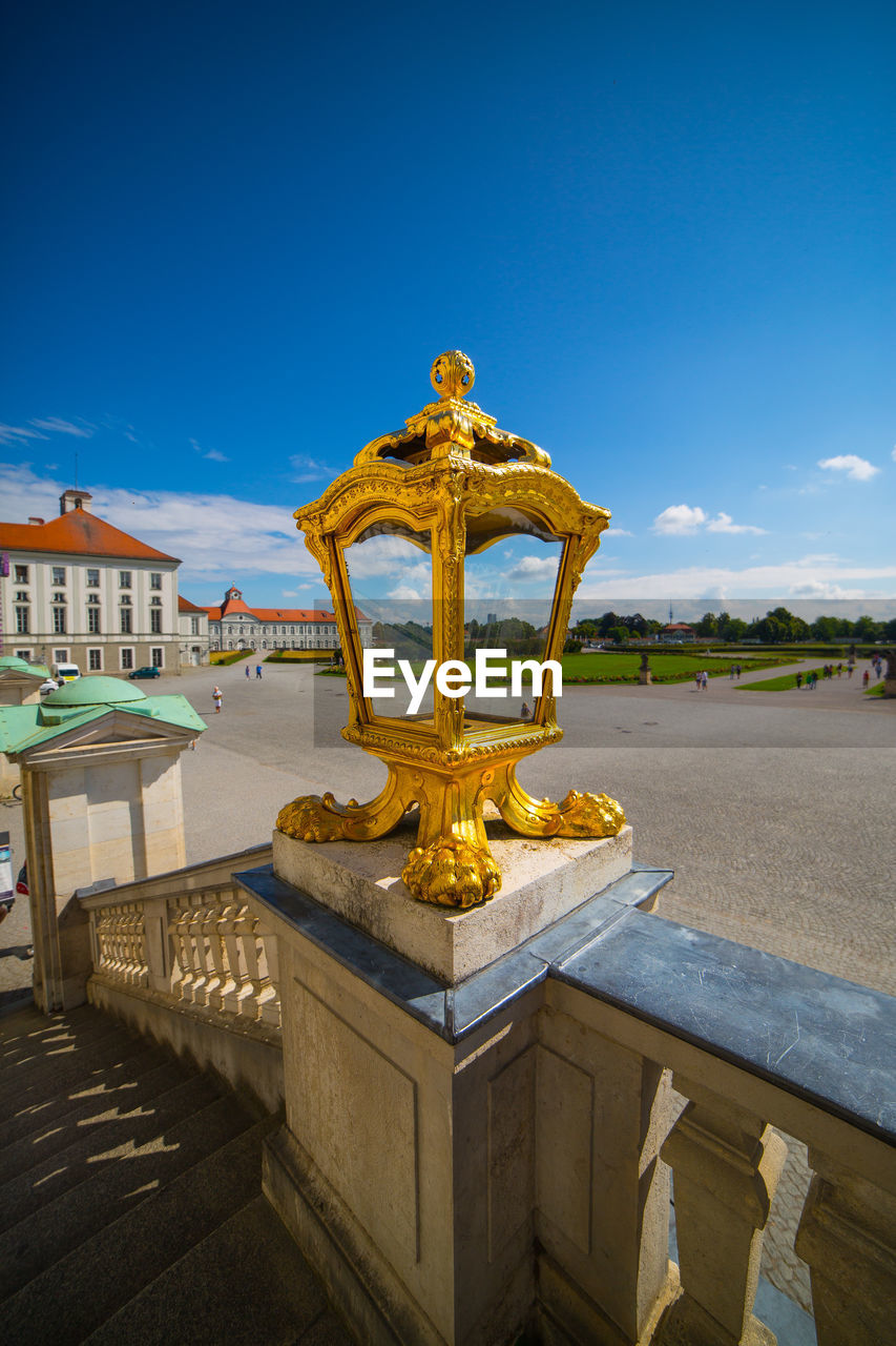 Gold lamp on steps railing at nymphenburg palace