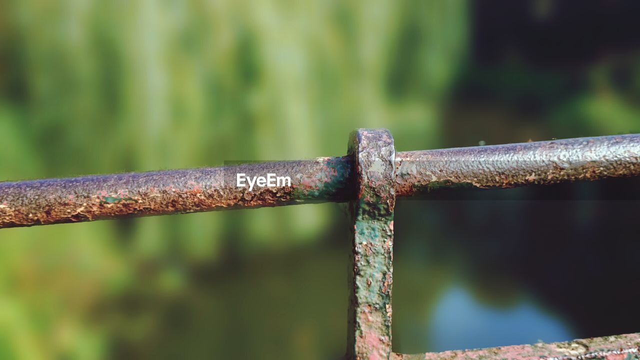 Close-up of rusty metal fence