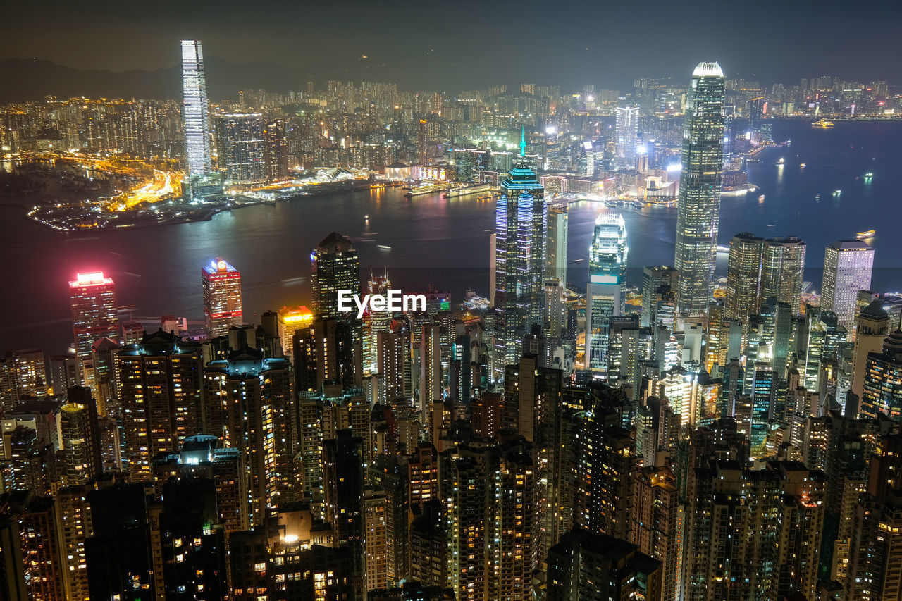 Illuminated modern buildings in city at night