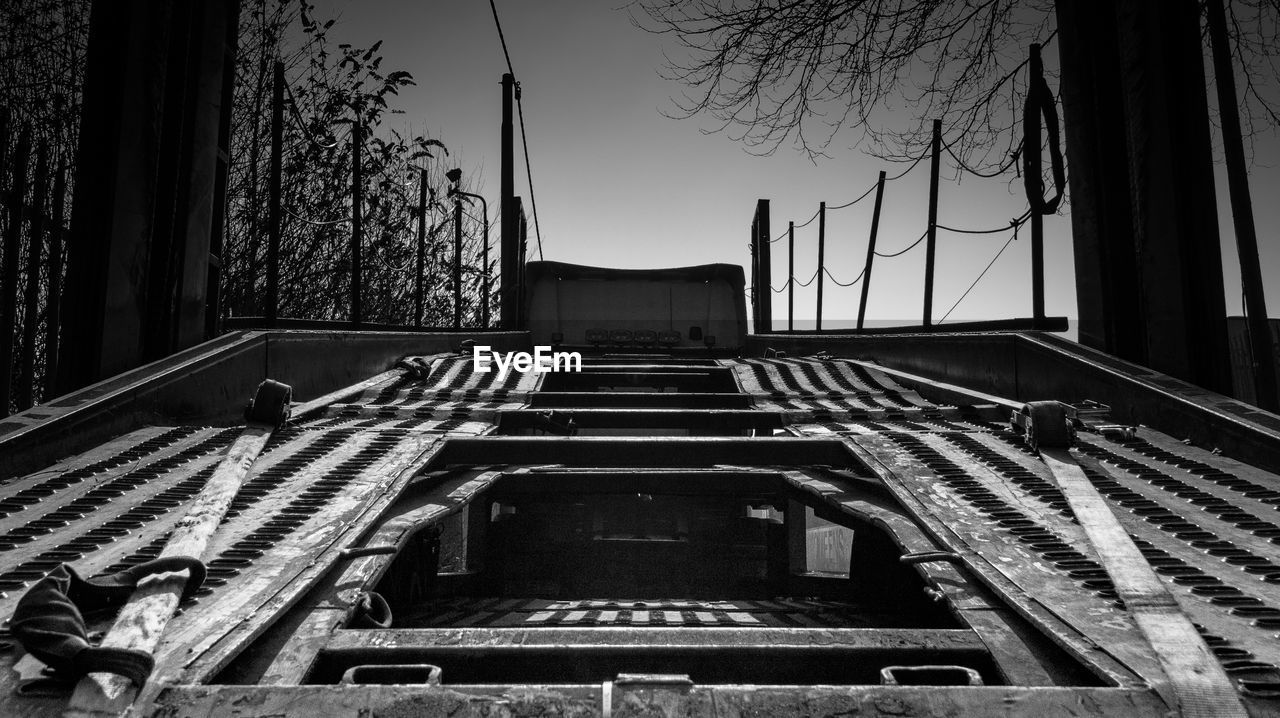 Empty vehicle trailer against sky